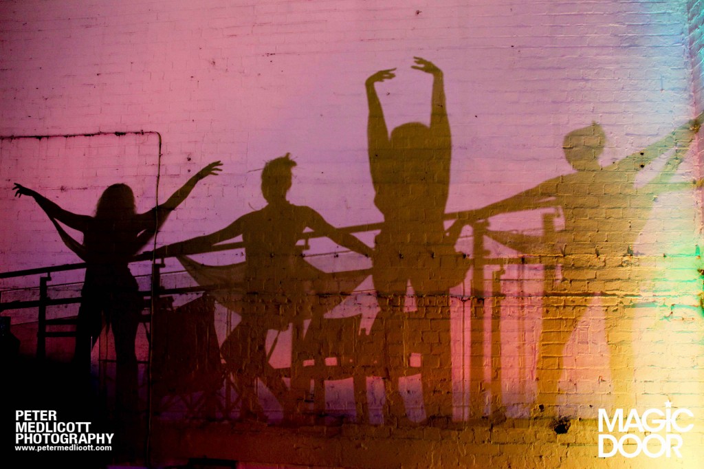Girls-dancing-in-reflection-shaddow-Magical-Clubbing-Birmingham-Magic-Door-commercial-photographer-Peter-Medlicot