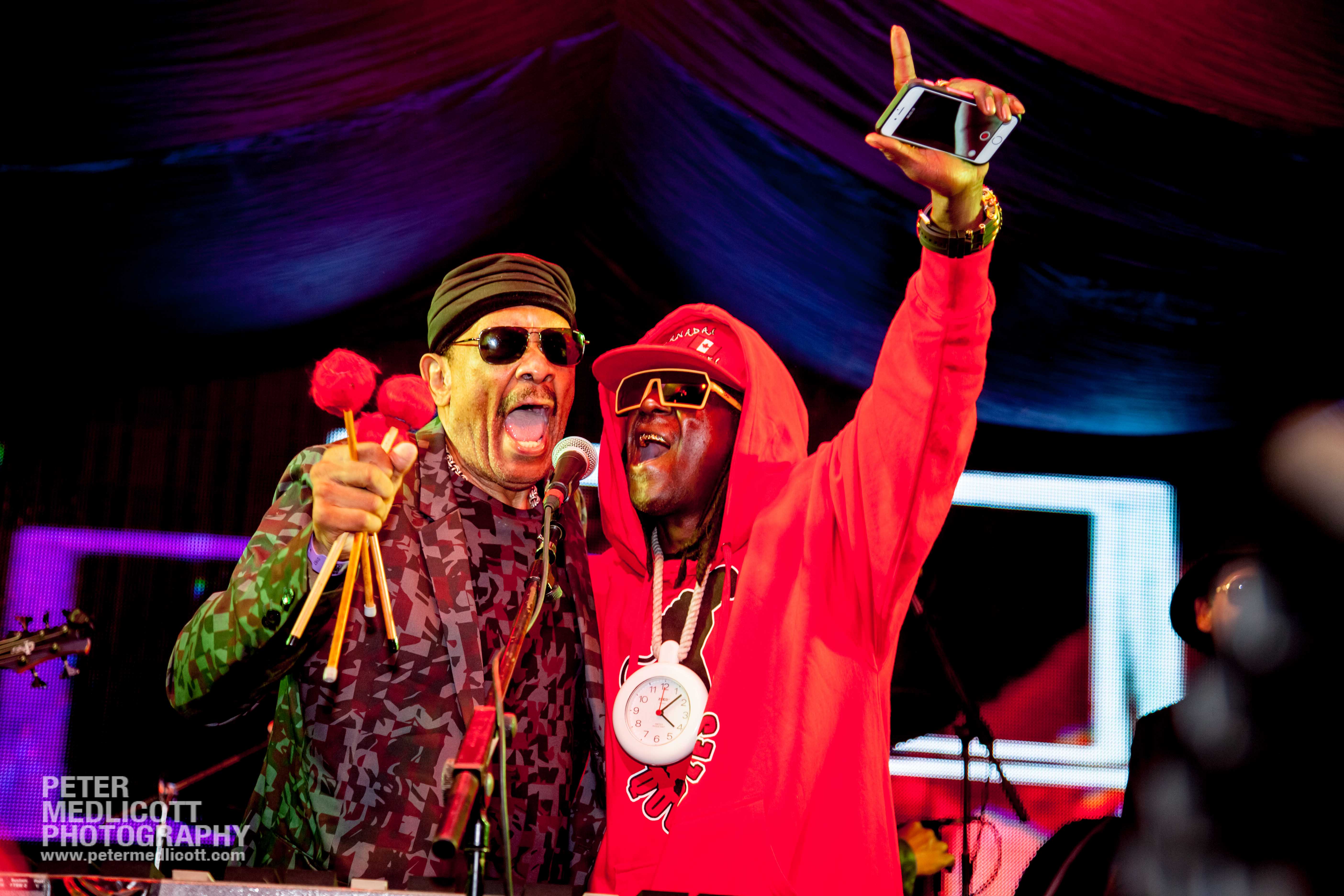 Flava Flav and Roy Ayers sing on stage at Mostly Jazz festival Hip Hop Jazz legends by lifestyle and music photographer Birmingham Peter Medlicott